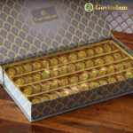 Anjeer Cake pieces served on silver platter with festive decorations