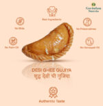 Gujiyas served on brass plate with Holi color powders and marigold flowers