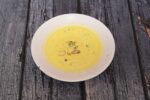Soft Rasmalai soaked in saffron-flavored milk.