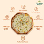 Close-up of Paneer Ghewar topped with crumbled paneer and dry fruits