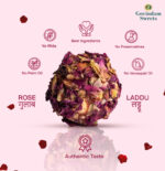 Close-up of pink Rose Laddu garnished with rose petals and silver varak