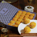 Jodhpuri Laddus on a brass thali with festive Rajasthani elements