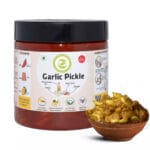 Clear jar of garlic pickle showing whole preserved cloves